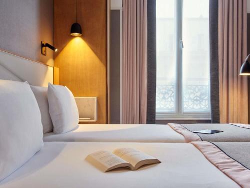 Habitación Doble Clásica - 2 camas del hotel Mercure Paris Opéra Garnier. Foto 9