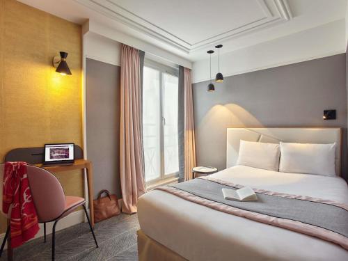 Habitación Individual Clásica del hotel Mercure Paris Opéra Garnier. Foto 1