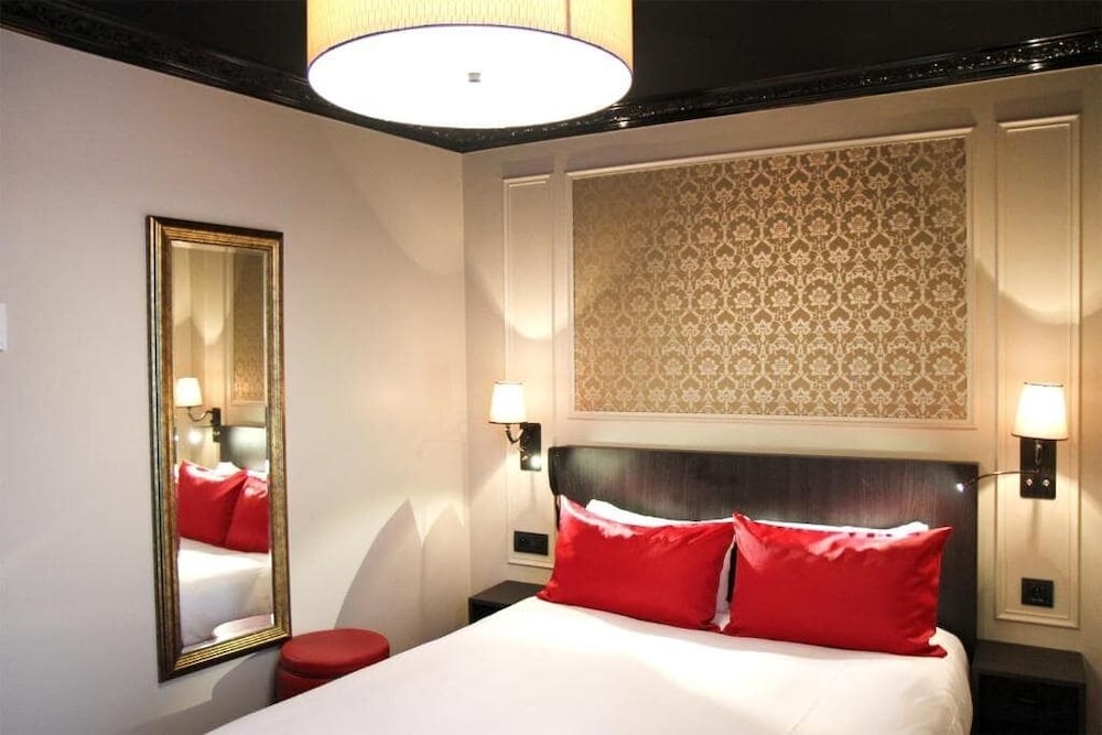 Habitación con 2 camas individuales, accesible en silla de ruedas del hotel Le Montmartre Saint Pierre. Foto 3