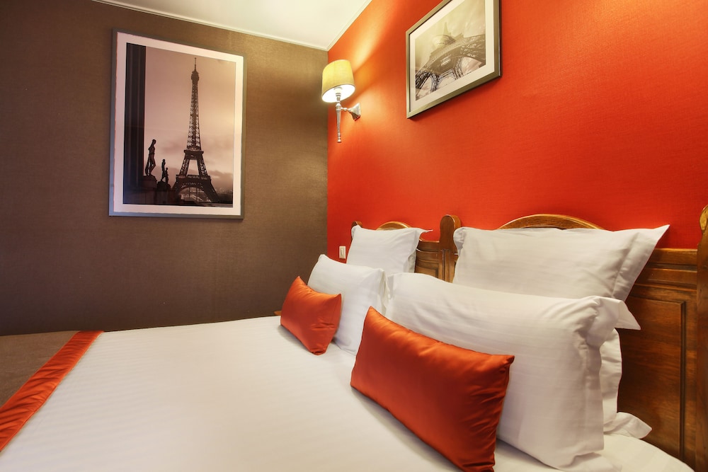 Habitación con vista a la Torre Eiffel del hotel Trianon Rive Gauche. Foto 1