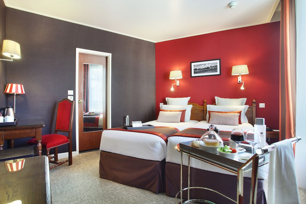 Habitación con 2 camas individuales del hotel Trianon Rive Gauche. Foto 1