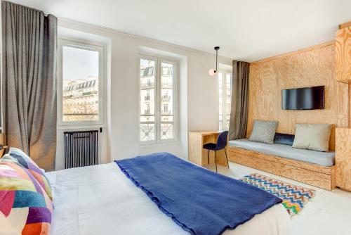 Habitación Triple del hotel Montholon Paris