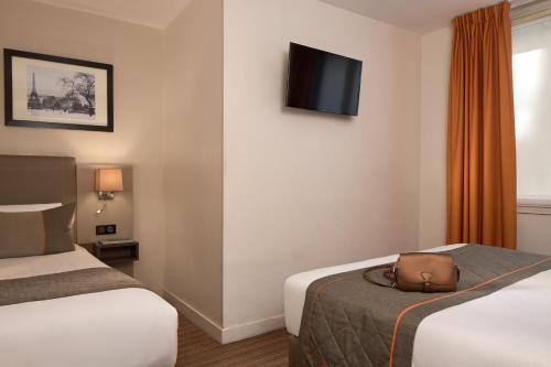 Habitación Triple del hotel Timhotel Opéra Madeleine. Foto 2