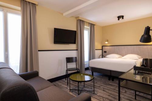 Habitación Triple Deluxe del hotel De L'aqueduc. Foto 6