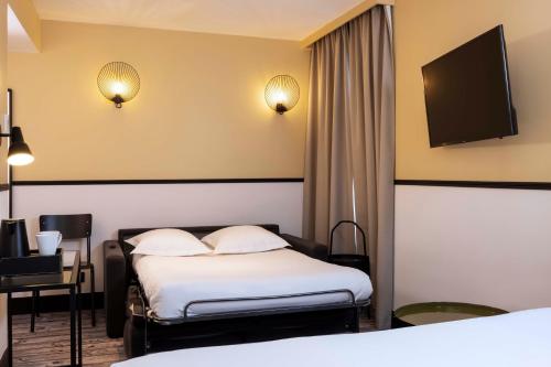Habitación Triple Deluxe del hotel De L'aqueduc. Foto 10