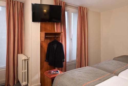 Habitación Triple del hotel Timhotel Paris Gare Montparnasse. Foto 2
