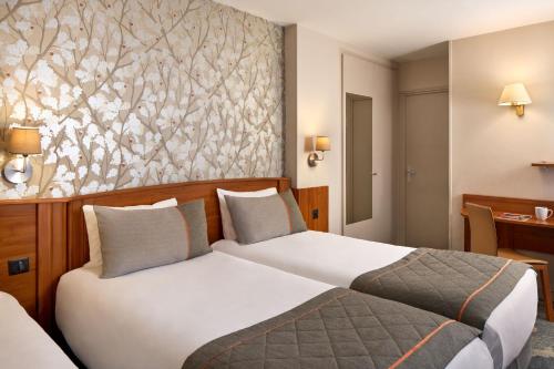 Habitación Triple del hotel Timhotel Paris Gare Montparnasse. Foto 3