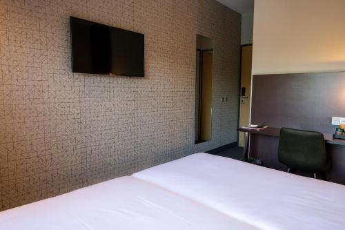 Habitación Doble - 2 camas del hotel Flonk Hotel Groningen Zuid, BW Signature Collection. Foto 4