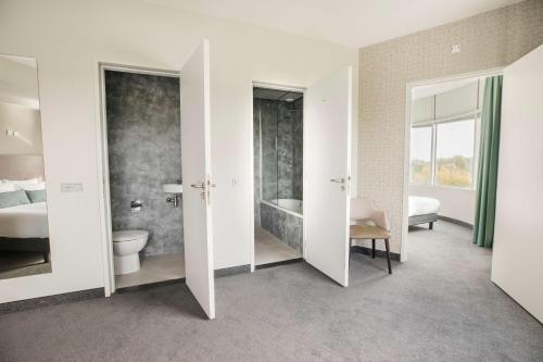Habitación Familiar Confort del hotel Flonk Hotel Groningen Zuid, BW Signature Collection. Foto 3