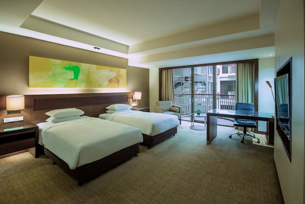 2 camas individuales del hotel Hyatt Regency Kinabalu. Foto 2