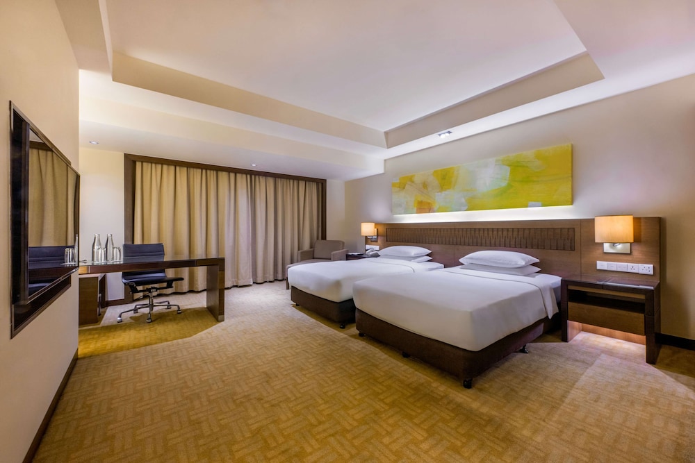 2 camas individuales del hotel Hyatt Regency Kinabalu. Foto 5