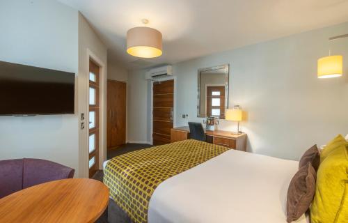 Estándar Deluxe con cama grande del hotel Riu Plaza The Gresham Dublin. Foto 12