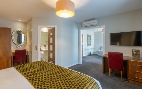 Suite Junior del hotel Riu Plaza The Gresham Dublin. Foto 1
