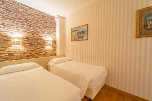 Habitación Triple del hotel Il Guercino. Foto 3