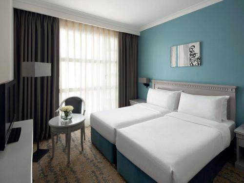 Habitación Doble Clásica con vistas a la ciudad - 2 camas del hotel Anwar Al Madinah Movenpick. Foto 1