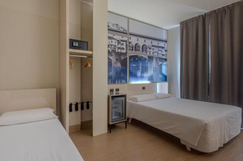 Habitación Triple del hotel ByB Firenze Nuovo Palazzo Di Giustizia. Foto 1