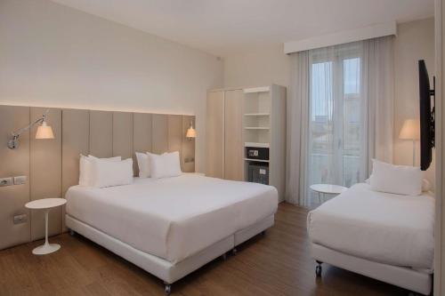 Habitaciones Familiares comunicadas del hotel Nh Genova Centro. Foto 3