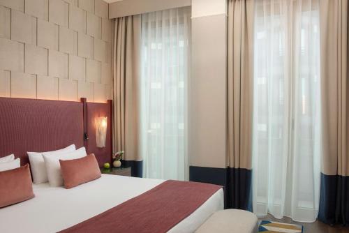 Suite Junior Executive con cama supletoria del hotel Tivoli President Milano. Foto 3