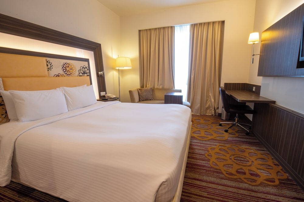 Habitación Deluxe con 2 camas individuales, 2 camas individuales del hotel Novotel Pune Viman Nagar. Foto 1