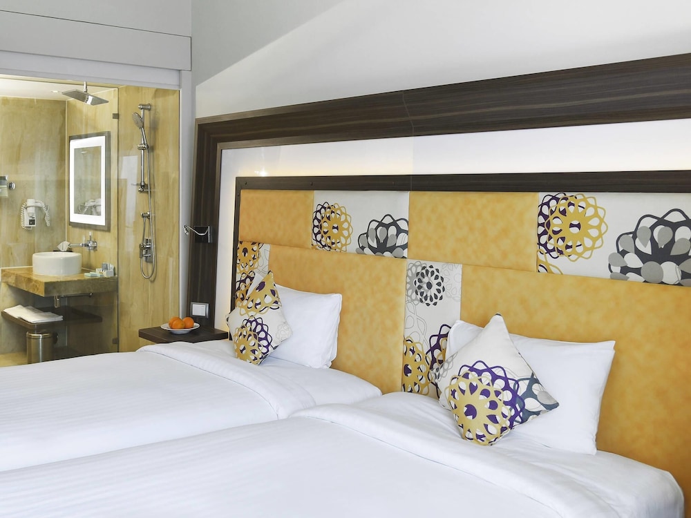 Habitación Deluxe con 2 camas individuales, 2 camas individuales del hotel Novotel Pune Viman Nagar. Foto 4