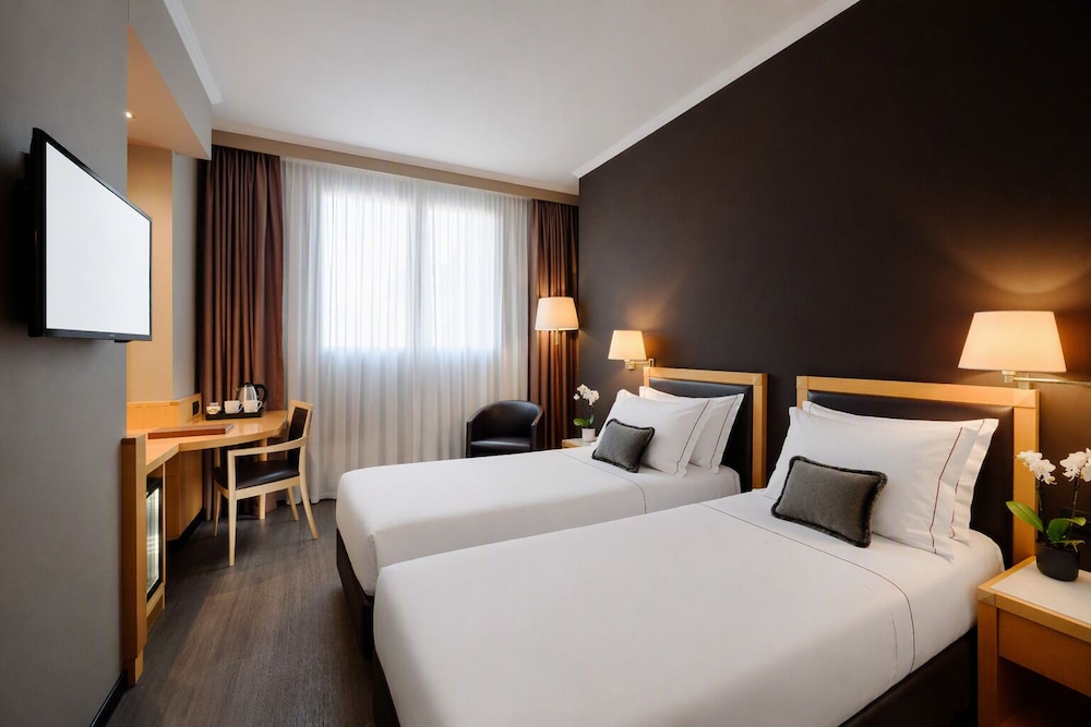 Habitación ejecutiva con 2 camas individuales del hotel City Life Hotel Poliziano - By R Collection Hotels. Foto 3