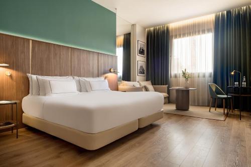 Habitación The Level con acceso al salón del hotel Melia Milano