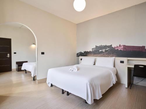 Habitación Triple del hotel B&B Napoli. Foto 1