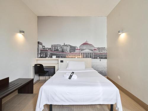 Habitación Triple del hotel B&B Napoli. Foto 3