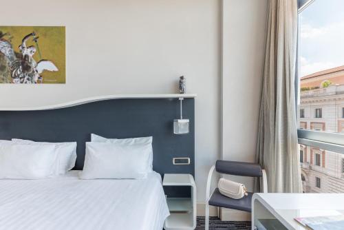 Habitación Doble Confort con cama grande del hotel Best Western Premier Royal Santina. Foto 9