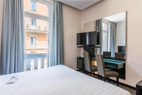 Habitación Doble Confort con cama grande del hotel Best Western Plus Universo Roma. Foto 4