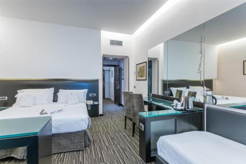 Habitación Familiar Superior del hotel Best Western Plus Universo Roma
