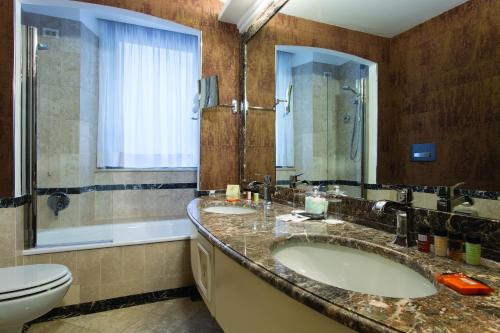 Habitación Doble Deluxe del hotel Dei Mellini. Foto 4