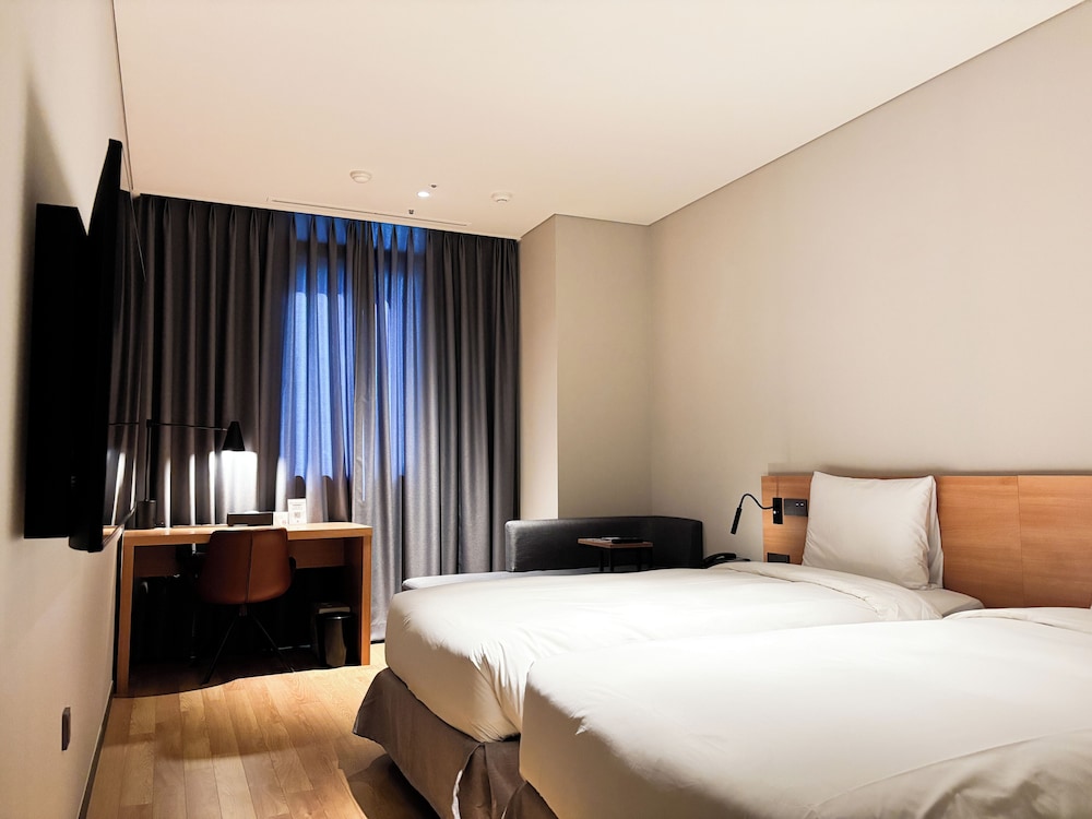 Habitación superior con 2 camas individuales del hotel Ibis Suwon Ambassador