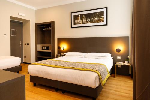 Habitación Triple Deluxe del hotel The Cross