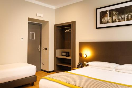 Habitación Triple Deluxe del hotel The Cross. Foto 1