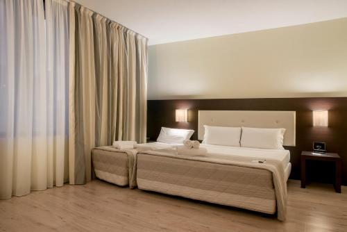 Habitación Triple Estándar del hotel Executive. Foto 3