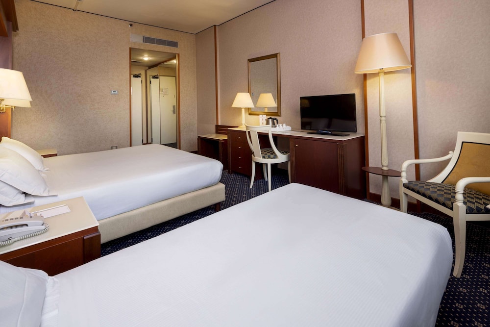 Habitación clásica, varias camas del hotel Best Western Ctc Verona. Foto 3