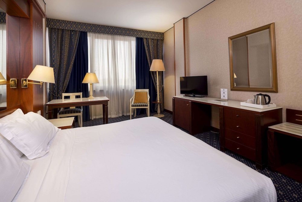 Habitación estándar, varias camas, habitaciones comunicadas del hotel Best Western Ctc Verona. Foto 2