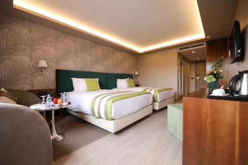 Habitación Doble Deluxe con vistas al jardín - 2 camas del hotel Kenzi Rose Garden. Foto 4