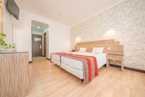 Habitación Doble con cama supletoria - 1 o 2 camas del hotel Melius. Foto 1