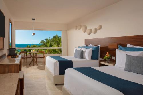 Habitación Doble Premium con vistas parciales al mar del hotel Dreams Sands Cancun Resort and Spa - All Inclusive. Foto 5
