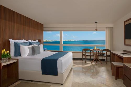 Suite Junior Preferred Club - cama extragrande del hotel Dreams Sands Cancun Resort and Spa - All Inclusive. Foto 3