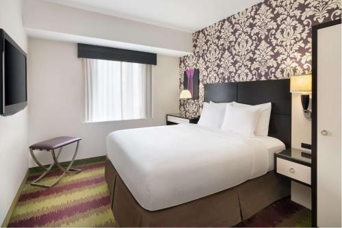 Habitación con ducha accesible en silla de ruedas - Cama grande - Adaptada para personas con movilidad reducida - No fumadores del hotel BEST WESTERN PREMIER HERALD SQUARE. Foto 1