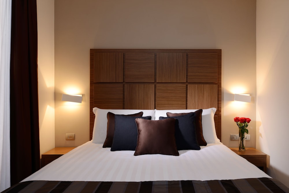 Habitación Triple del hotel Rome Art. Foto 1