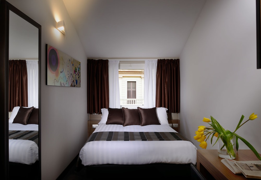 Habitación Cuádruple del hotel Rome Art. Foto 1