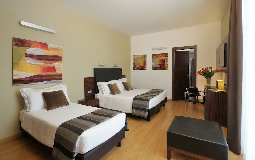 Habitación Cuádruple del hotel Rome Art. Foto 2