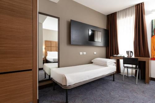 Habitación Triple del hotel Rome Art. Foto 4