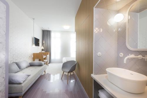 Habitación Triple Deluxe del hotel Lapin Blanc. Foto 1