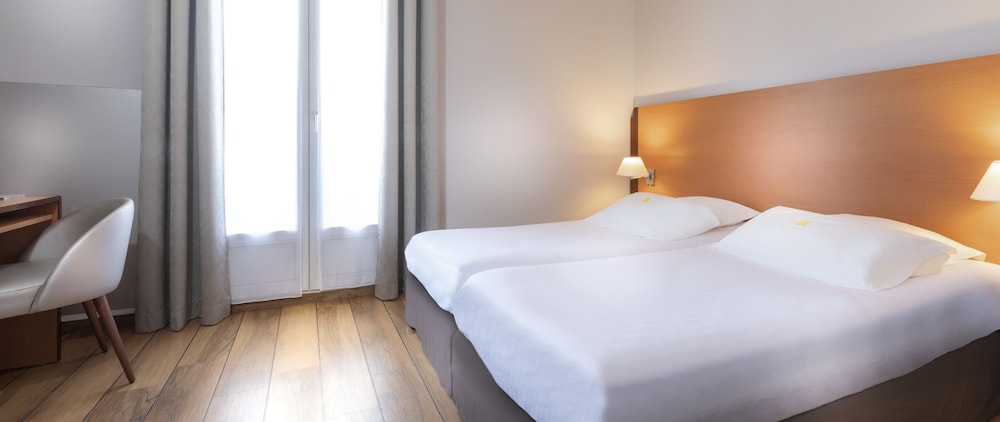 Habitación con 2 camas individuales (parisienne) del hotel Du Lion