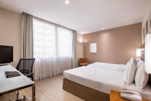 Habitación Deluxe comunicada del hotel Melia Paulista. Foto 4